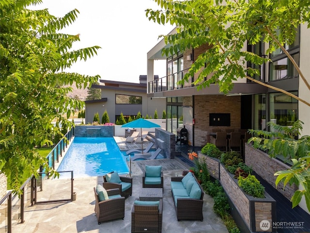 64 Orchard Pl, Orondo, WA 98843 - view of swimming pool featuring outdoor lounge area, a patio area, and a fenced in pool