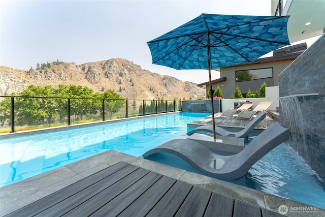 64 Orchard Pl, Orondo, WA 98843 - view of swimming pool featuring a fenced in pool, fence, and a mountain view