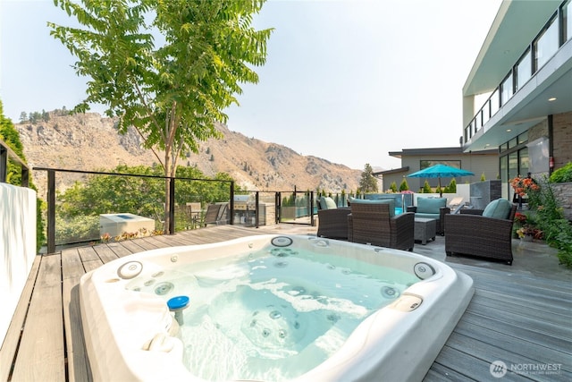 64 Orchard Pl, Orondo, WA 98843 - wooden deck featuring hot tub deck surround, outdoor lounge area, and a mountain view