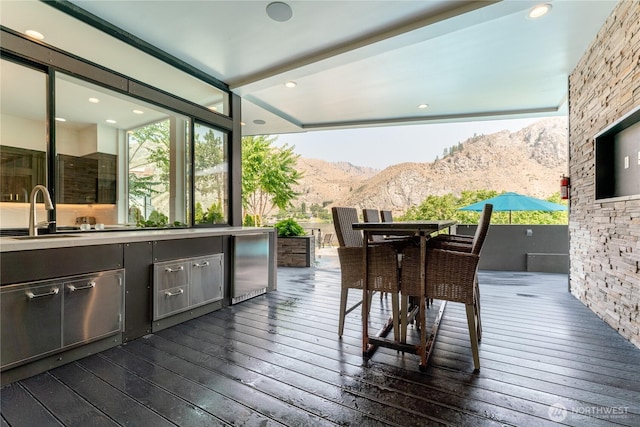 64 Orchard Pl, Orondo, WA 98843 - wooden deck featuring a sink and outdoor dining space