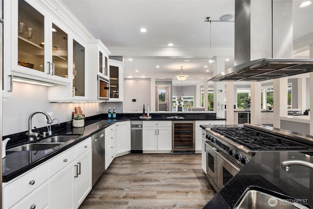 26408 136th Ave SE, Kent, WA 98042 - kitchen featuring wine cooler, island range hood, a sink, dark stone counters, and stainless steel appliances