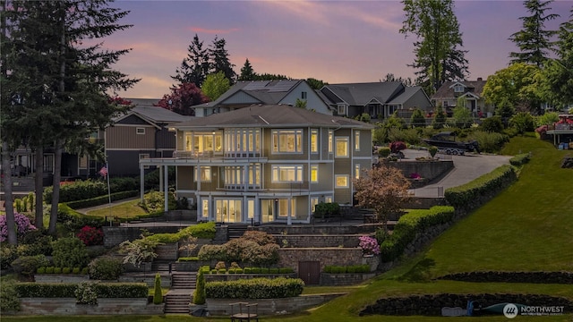 26408 136th Ave SE, Kent, WA 98042 - back of house at dusk with stairway, a balcony, and a deck
