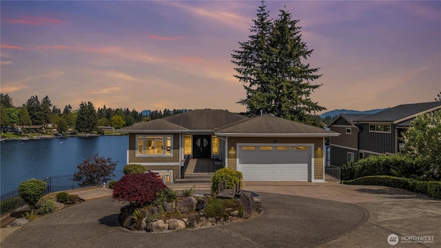 26408 136th Ave SE, Kent, WA 98042 - view of front facade featuring an attached garage, driveway, and a water view