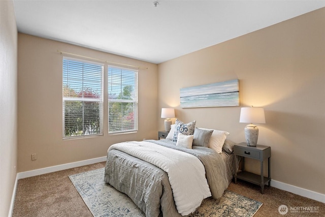 carpeted bedroom featuring baseboards
