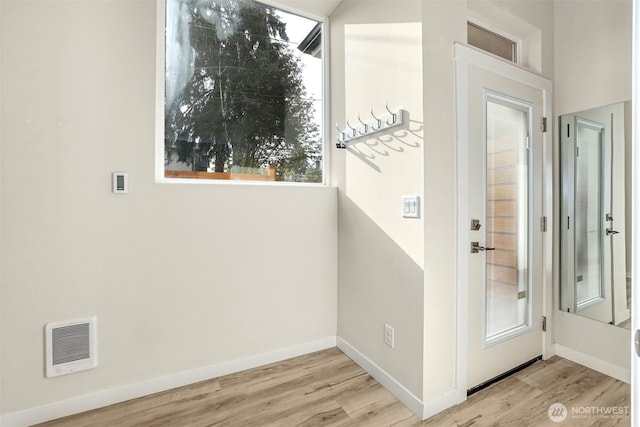 1400 N 95th St, Seattle, WA 98103 - doorway featuring visible vents, wood finished floors, and baseboards