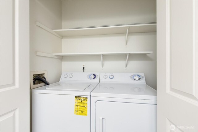 washroom featuring laundry area and washer and clothes dryer
