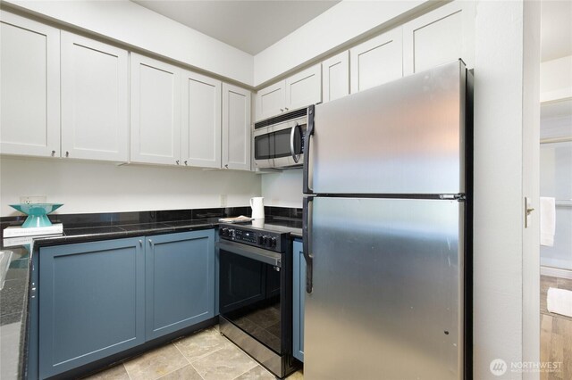 kitchen featuring white cabinets and stainless steel appliances