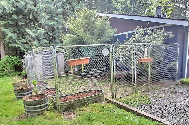 view of yard with a garden and fence