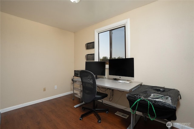 home office featuring baseboards and wood finished floors