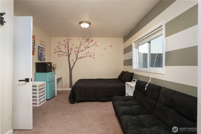 carpeted bedroom featuring baseboards