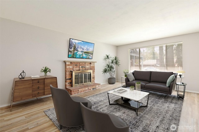 801 141st St S, Tacoma, WA 98444 - living area featuring baseboards, a brick fireplace, and wood finished floors
