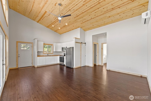 428 Castle Ave, Winthrop, WA 98862 - unfurnished living room featuring high vaulted ceiling, a barn door, ceiling fan, wooden ceiling, and dark wood-type flooring