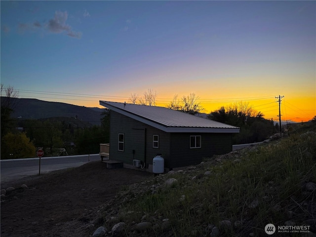 428 Castle Ave, Winthrop, WA 98862 - view of side of home featuring a metal roof and a mountain view