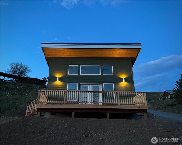 back of house with a wooden deck
