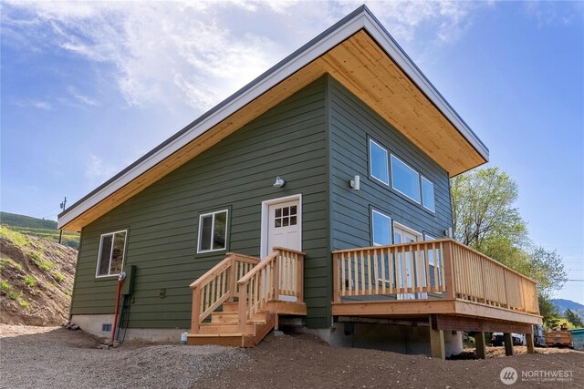 rear view of house with a deck