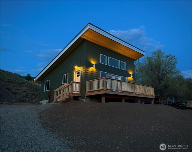 back of property featuring a deck