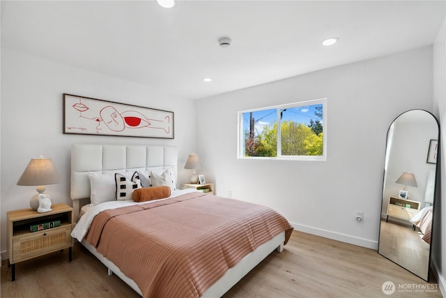 bedroom with baseboards, recessed lighting, and light wood-type flooring