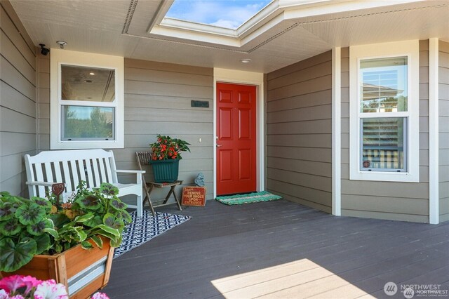 entrance to property featuring a porch