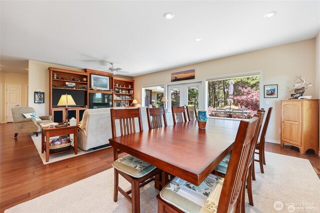 dining room with recessed lighting, a ceiling fan, and wood finished floors