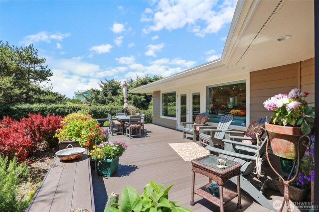 deck featuring french doors and outdoor dining area