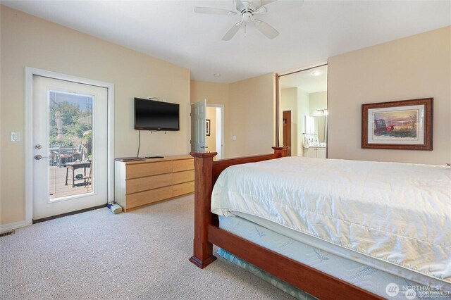 bedroom featuring connected bathroom, light colored carpet, access to exterior, a ceiling fan, and baseboards