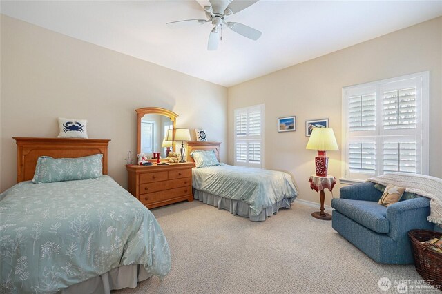 bedroom with carpet floors, baseboards, and a ceiling fan