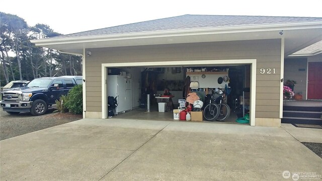 garage featuring driveway
