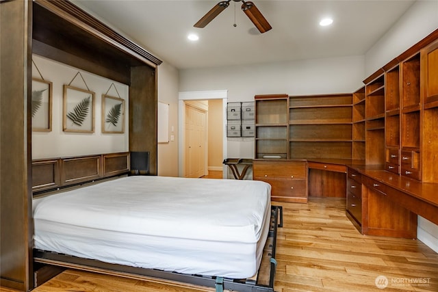 bedroom with light wood-style floors and recessed lighting
