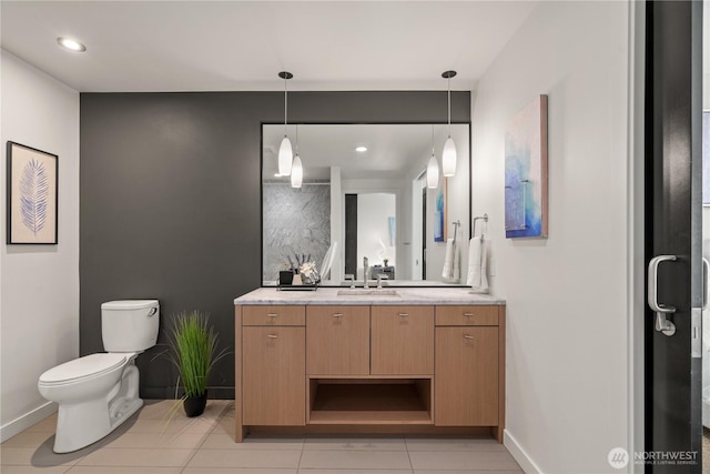 bathroom featuring tile patterned flooring, vanity, toilet, recessed lighting, and baseboards