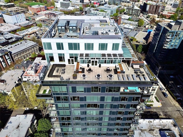 birds eye view of property featuring a city view