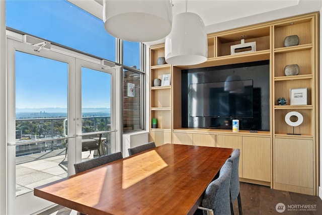 1321 Seneca St Unit 1008, Seattle, WA 98101 - dining space featuring built in shelves and dark wood-style floors