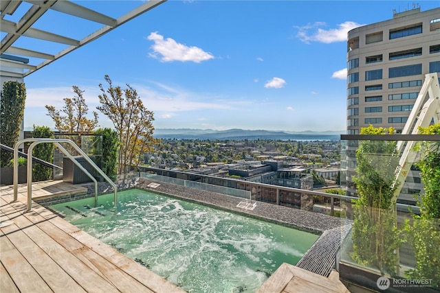 1321 Seneca St Unit 1008, Seattle, WA 98101 - view of swimming pool with a community hot tub and a deck with mountain view