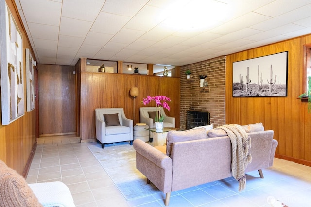 12223 4th Ave NW, Seattle, WA 98177 - living room featuring a brick fireplace, light tile patterned flooring, and wood walls
