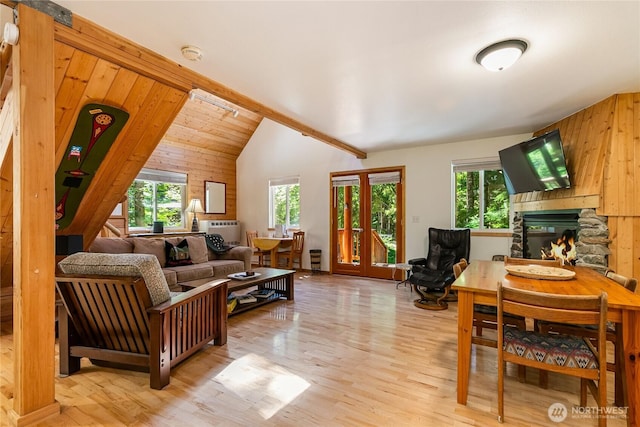 7502 Glacier Spgs, Deming, WA 98244 - living room with plenty of natural light, wood finished floors, lofted ceiling, and wood walls