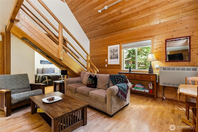 7502 Glacier Spgs, Deming, WA 98244 - living room with radiator heating unit, lofted ceiling, light wood-style flooring, wood walls, and wooden ceiling