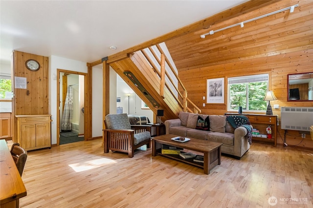 7502 Glacier Spgs, Deming, WA 98244 - living room with light wood-type flooring, wood walls, and heating unit