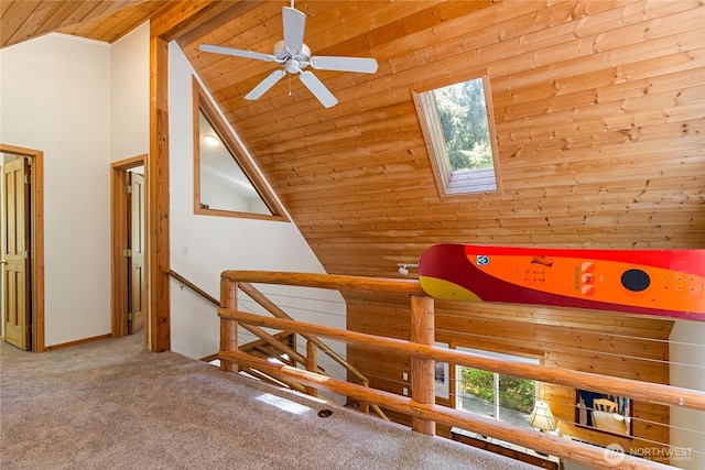7502 Glacier Spgs, Deming, WA 98244 - hallway with wooden ceiling, a skylight, carpet floors, an upstairs landing, and high vaulted ceiling