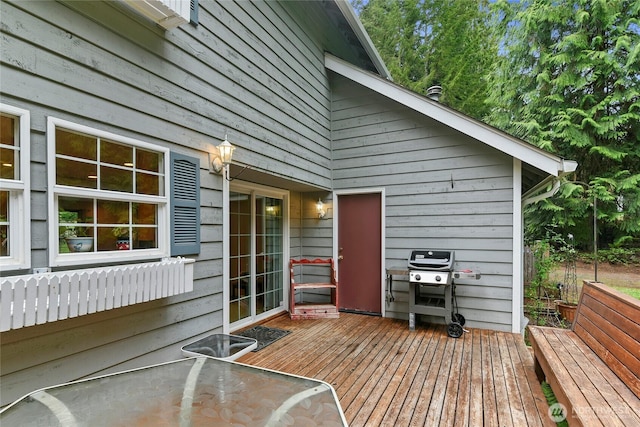 wooden terrace with area for grilling