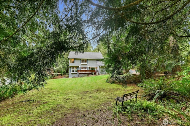 view of yard with a wooden deck
