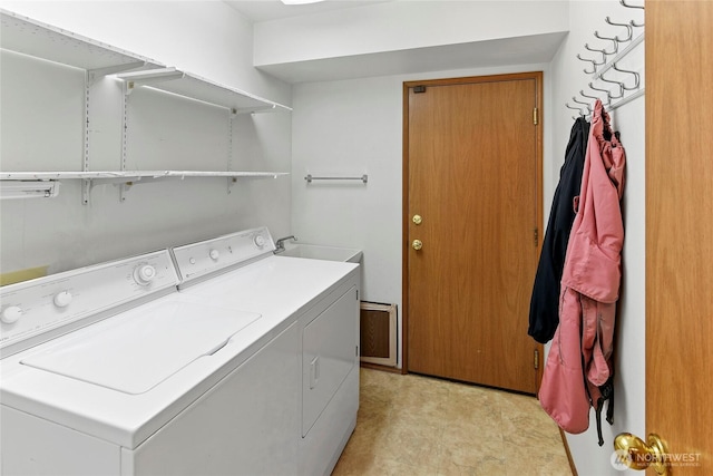 laundry room featuring laundry area and washing machine and clothes dryer