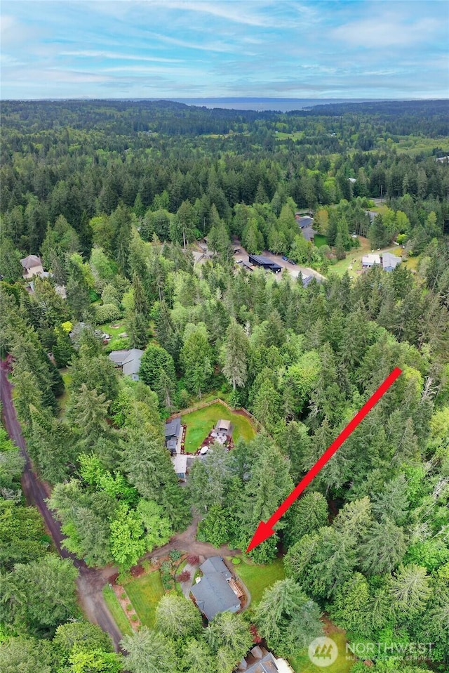aerial view featuring a view of trees