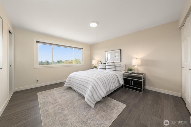 13445 SE 43rd St, Bellevue, WA 98006 - bedroom with dark wood-style flooring, baseboards, and a closet