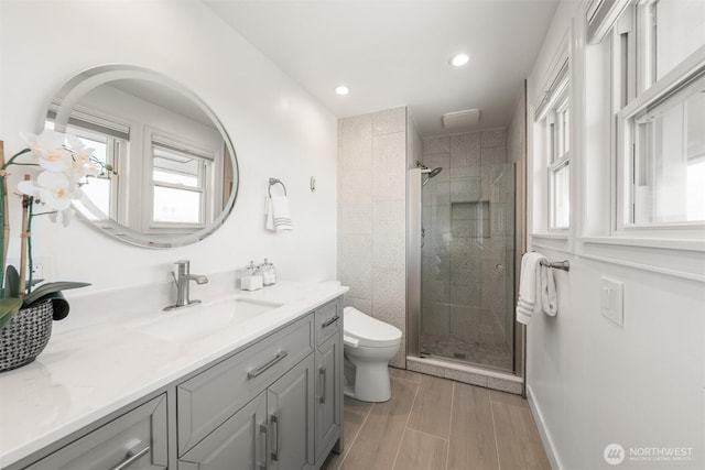 13445 SE 43rd St, Bellevue, WA 98006 - full bathroom with vanity, wood finished floors, toilet, and a shower stall