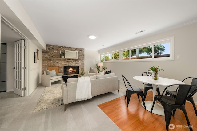 13445 SE 43rd St, Bellevue, WA 98006 - living room with visible vents, baseboards, a brick fireplace, and carpet floors