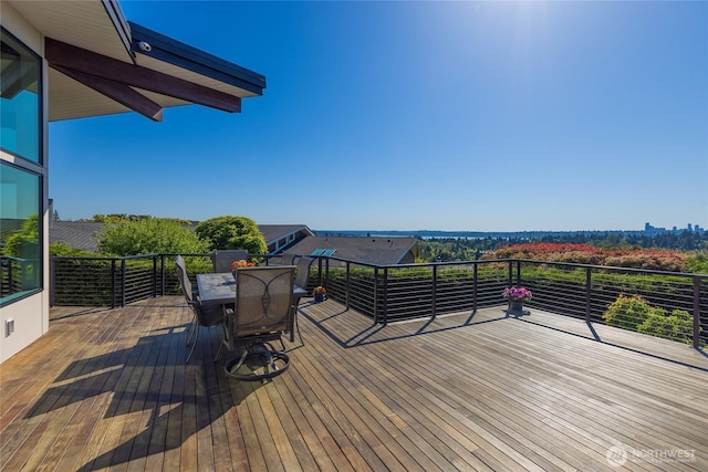 deck featuring outdoor dining area