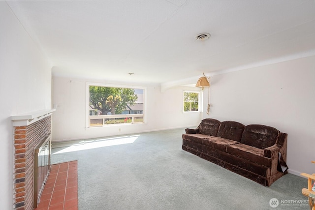 carpeted living room with visible vents, baseboards, and a brick fireplace