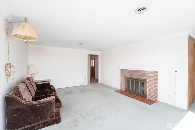 unfurnished living room featuring ornamental molding, carpet, a brick fireplace, and visible vents