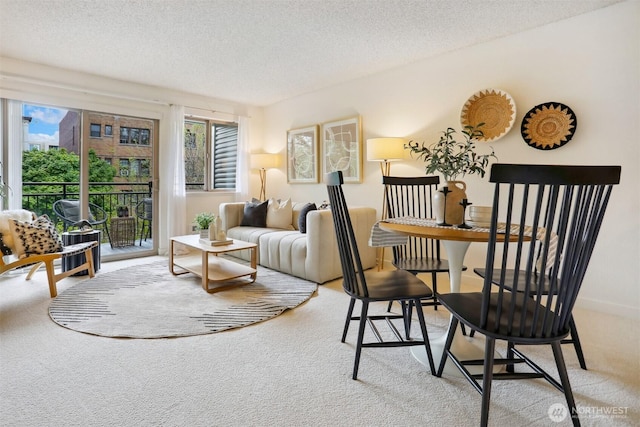 275 W Roy St Unit 216, Seattle, WA 98119 - dining area featuring light colored carpet and a textured ceiling