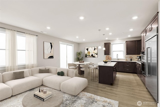 13447 NE 104th Way Unit 3, Kirkland, WA 98033 - living room featuring recessed lighting and light wood-style flooring