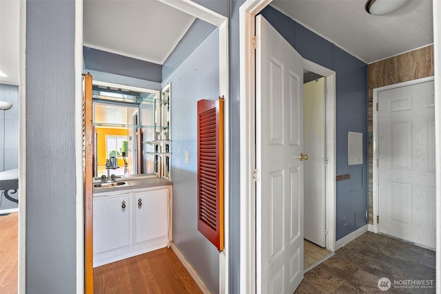 1402 22nd St NE Unit 65, Auburn, WA 98002 - hall featuring a sink and baseboards